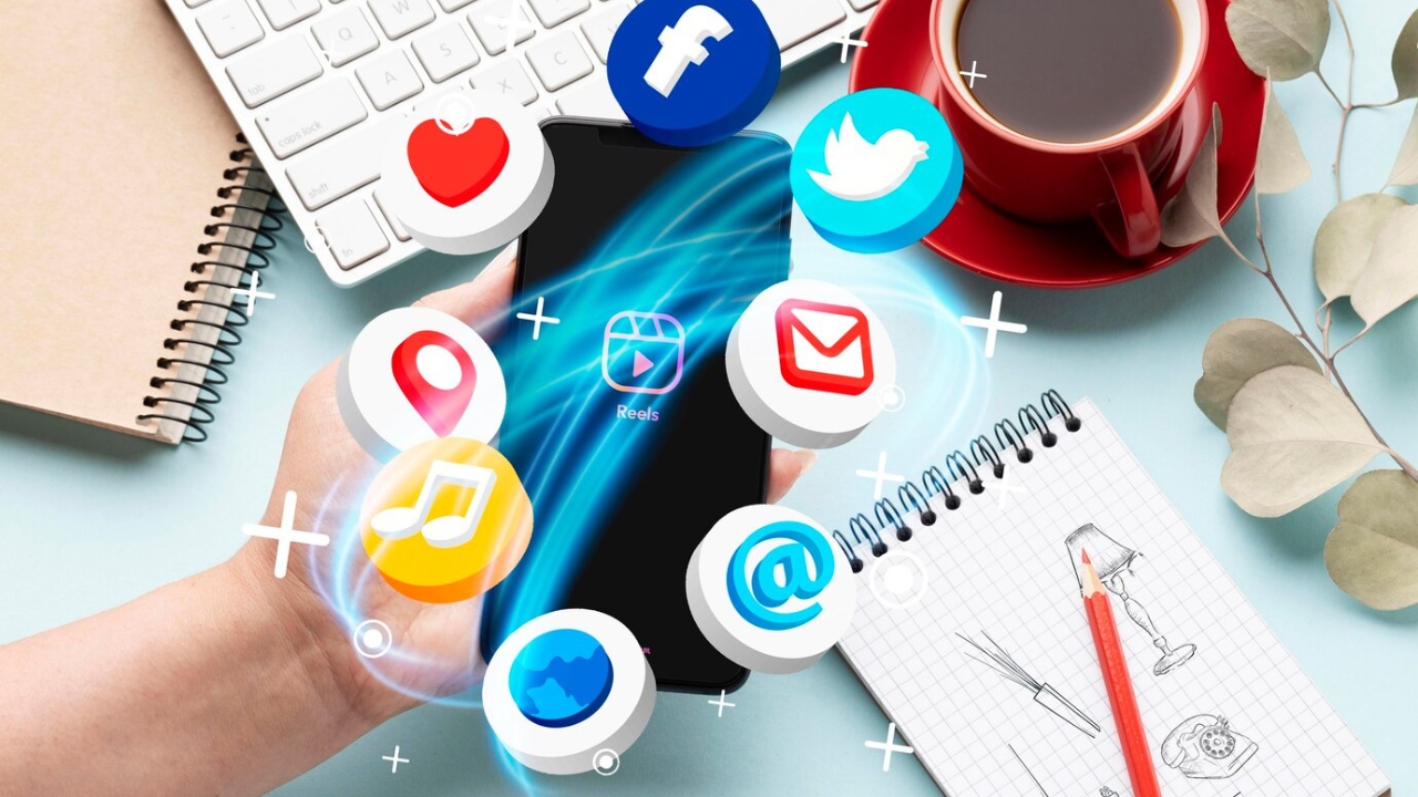 Hand holding a smartphone surrounded by social media icons.