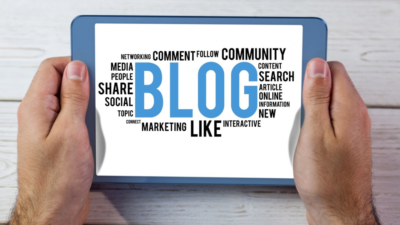 Tablet screen showing words like "BLOG," "MARKETING," "COMMUNITY," and "SHARE."
